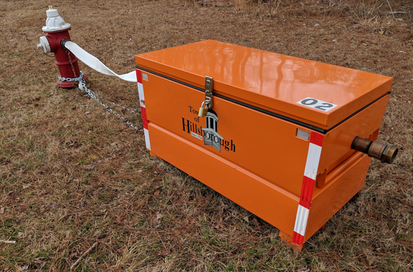 Image of hydrant with orange box housing meter and backflow preventer