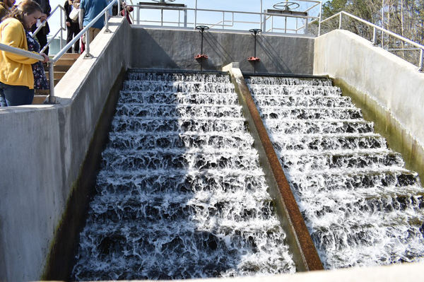 Water flows over aerating mechanism before being released from Wastewater Treatment Plant into Eno River.